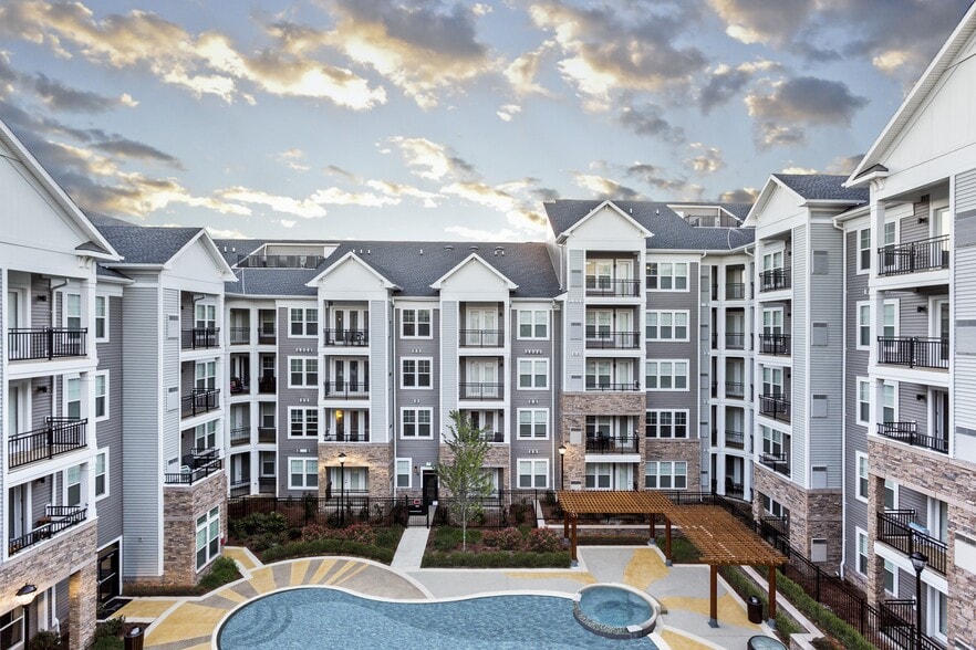 Resort-Style Swimming Pool With Expansive Tanning Areas
