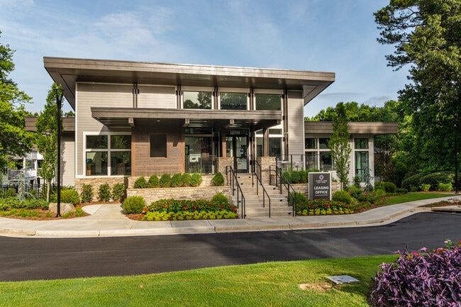 Lush landscaping and modern design create the perfect first impression.