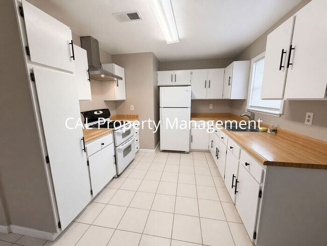 Photo - Spacious 4-Bedroom Home with 2-Car Garage & Backyard Oasis