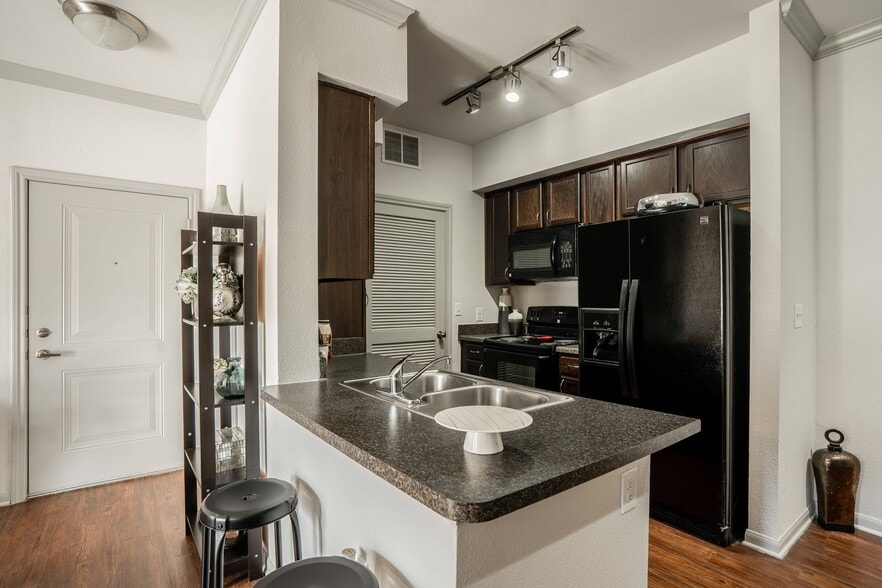 Chef-inspired kitchens with kitchen islands in select residences