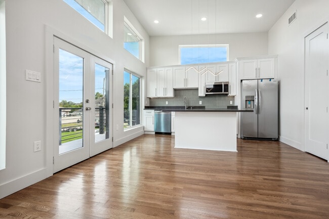 Kitchen with custom cabinetry, quartz countertops and stainless steel appliances - 428 W Solidelle St Unit A