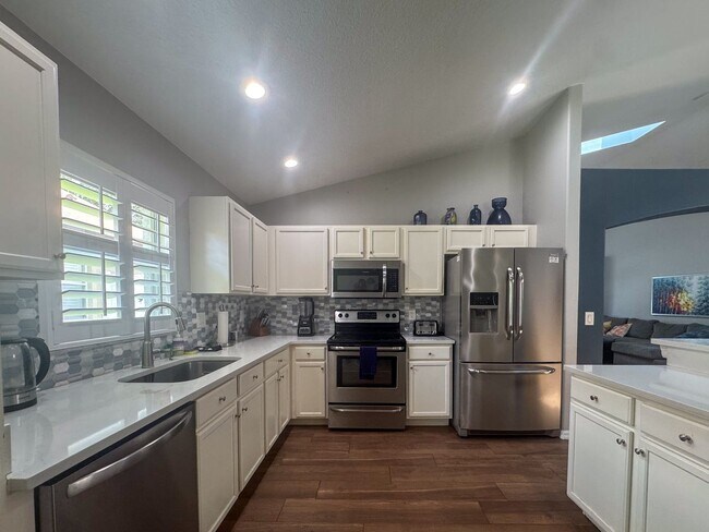 Photo - Beautifully updated and modern 5 bedroom 4 bathroom pool home located in the Orange Tree