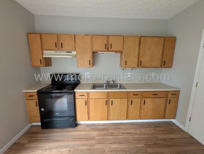 Photo - Remodeled home with fenced yard and large deck
