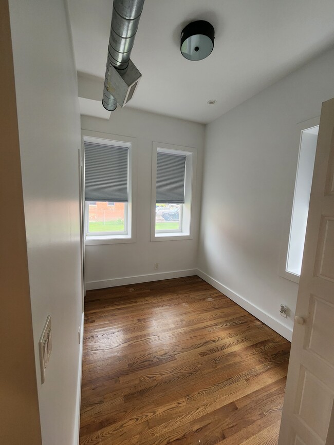 Cozy bedroom with in unit washer dryer - Corktown Ash Apartments