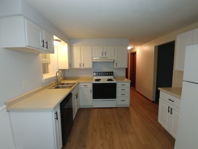 Kitchen with new cabinets and countertops - 92 Logan Ave W