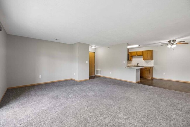A spacious open floor plan creates a warm, inviting atmosphere with plenty of room to relax, entertain, and make yourself at home.