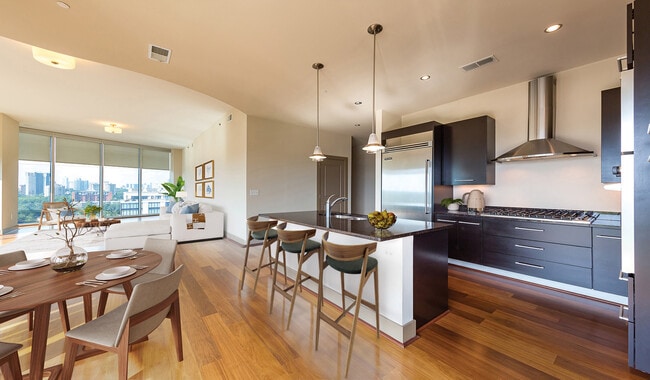 Open layout kitchen with a breakfast bar and pendant lighting