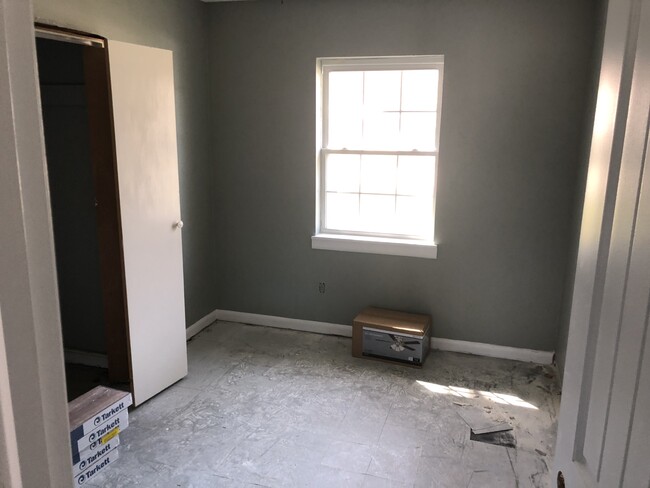 bedroom 1 ready for the new flooring and a little bit of frame work - 208 W Easy St House