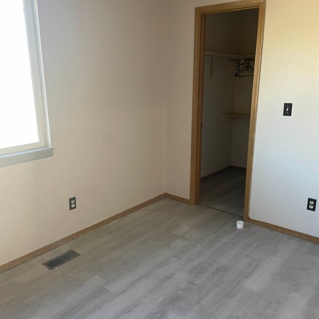 Bedroom with walk-in closet