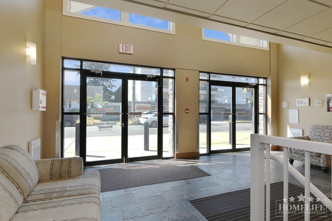 High-End Top-Floor 1 Bed + Den Condo with New Flooring & Paint in Central Chilliwack