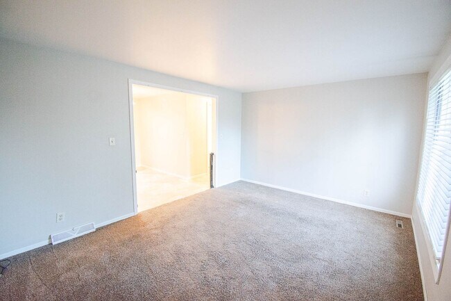 Photo - Ranch-style home with great fenced yard & patio!