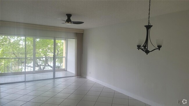 Building Photo - 6091 NW 61st Ave Unit 310 Rental