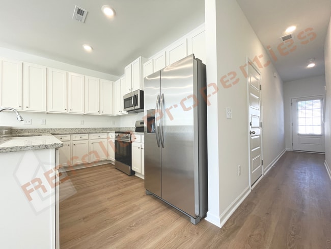 Photo - Move In by April 30 & Save $200/Month! Townhome Only $1,745! Regular $1,995 — Available NOW