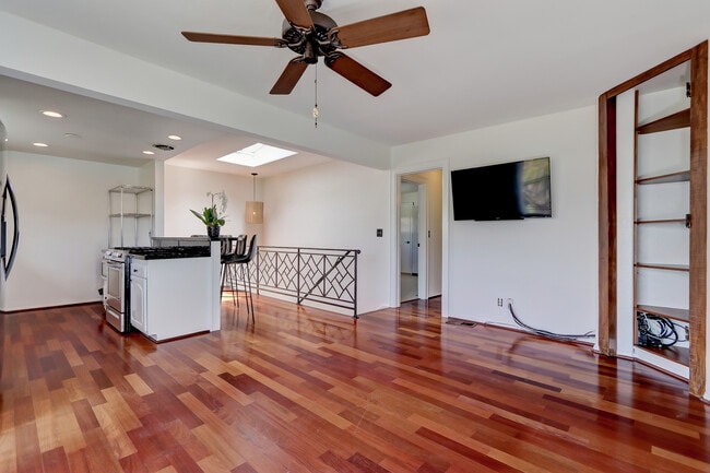 Oversized great room just off the kitchen features wonderful hardwood floors and balcony! - 744 12th St Unit 744 12th St