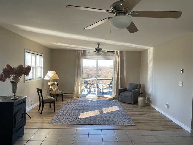 Living Room with access to oversized sunset deck - 387 Eichybush Rd Unit Apt. 3