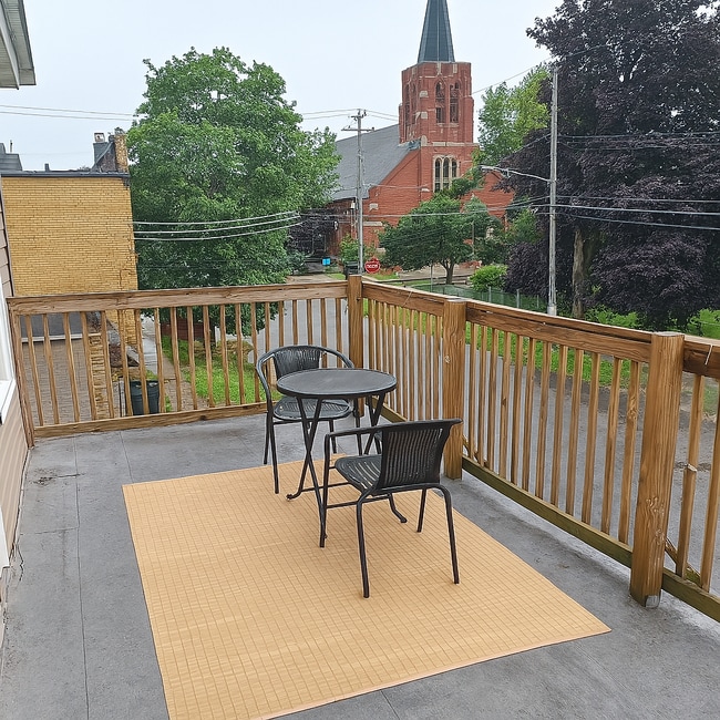 Walk-out patio - 109 Center Ave Apartments Unit Upper Front