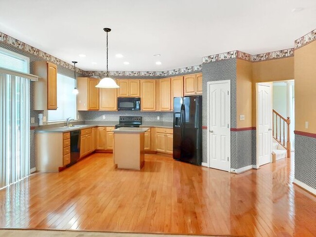 Photo - Single Family Home with 2 Car Garage Deck ...