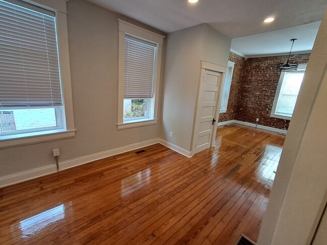 Dining room with front room in background - 1007 E McCarty St Unit B