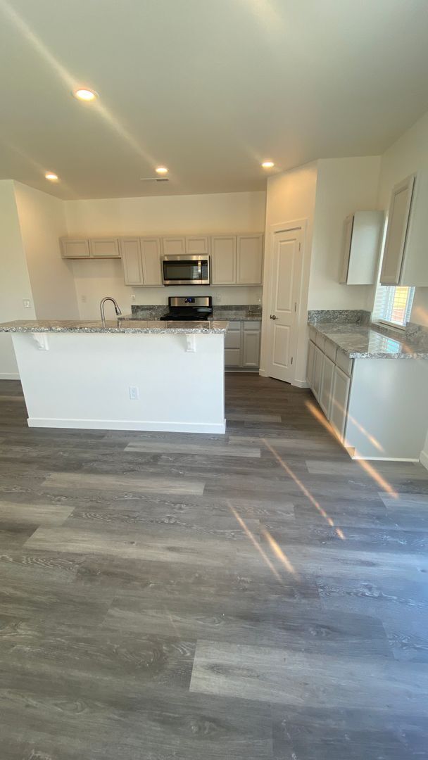 Photo - Brand new home with LVP flooring t/o, gran...