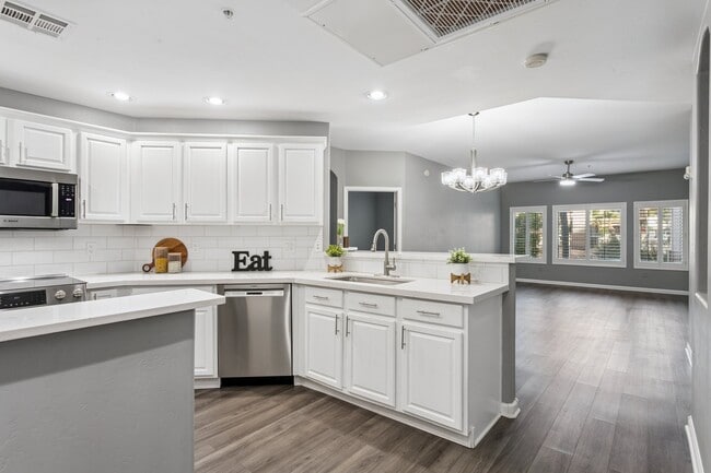 Opens to the great room with luxury vinyl flooring - 14000 N 94th St Unit 1089