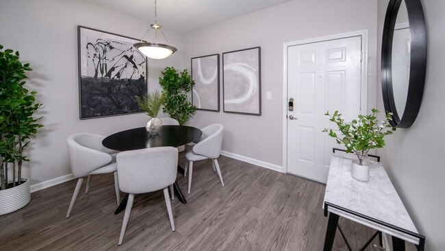 Savor intimate dining experiences in our chic and elegant dining area with modern lighting. - 12th and James Luxury Apartments