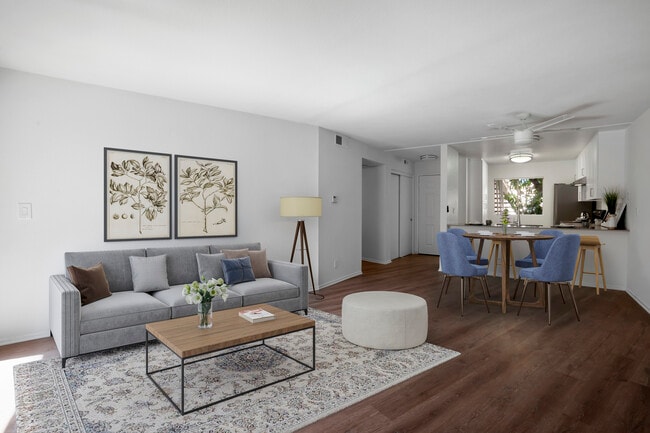 Renovated Package I living and dining room with hard surface flooring - eaves Phillips Ranch