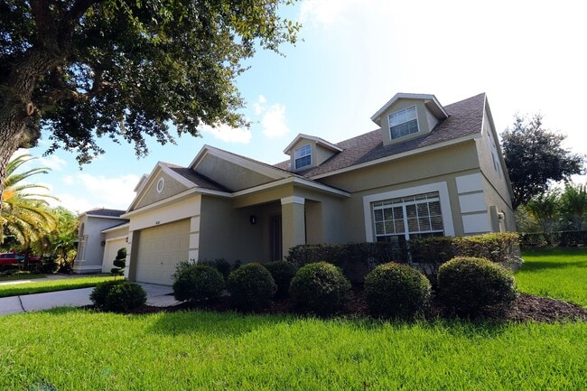 Building Photo - Beautiful 4-Bedroom Home in Gated Golf Community – East Orlando