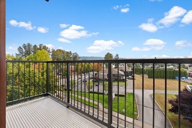 Step out onto your private balcony and take in peaceful views of the neighborhood and surrounding greenery.