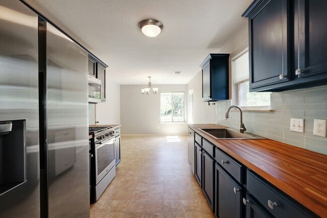 Photo - Charming 3BR / 2BA Rental with Fenced Yard & Covered Deck