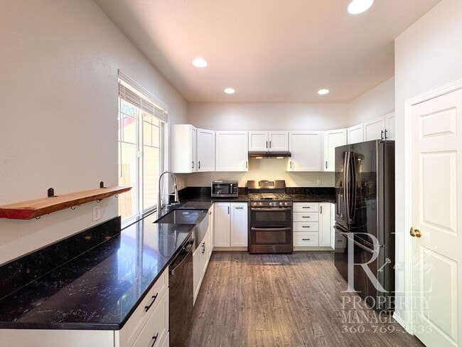 Photo - Dual Primary Suites, Huge Backyard Deck & Sun-Filled Living Spaces Near Everyday Conveniences
