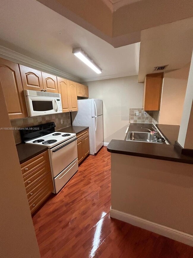 Building Photo - 7165 NW 186th St Unit A204