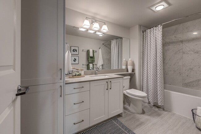 Our beautiful bathrooms have inset sinks on quartz countertops, and ample storage including a linen closet.