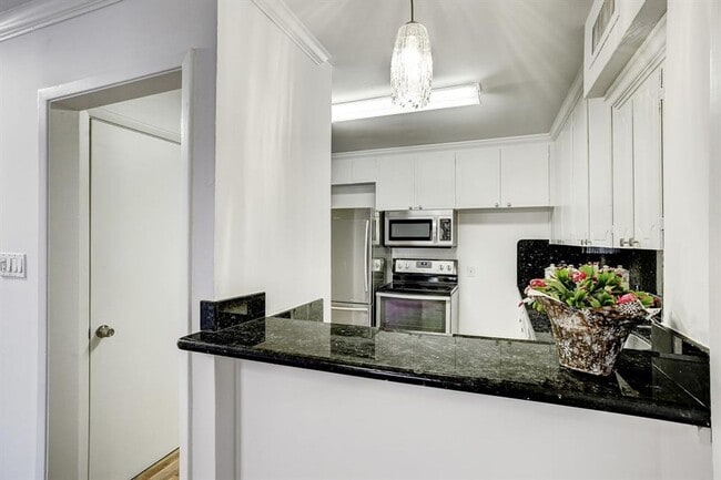 Photo - Beautifully remodeled two-story condo in a...