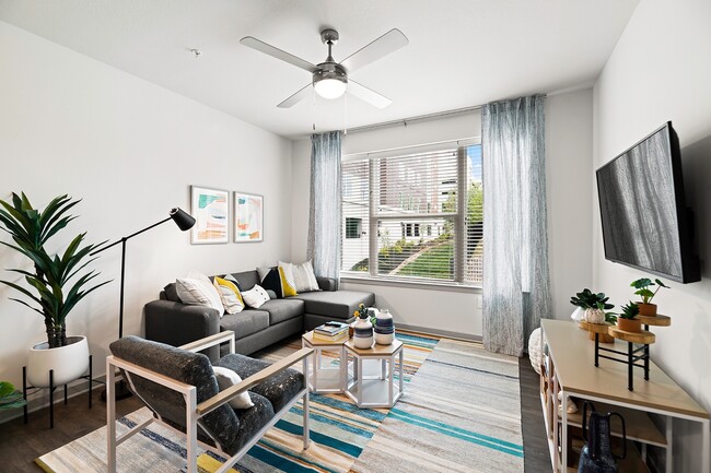 Nova-Knoxville-Formerly-Aspen-Heights-Knoxville-Off-Campus-Apartments-Near-The-University-of-Tennessee-Knoxville-Fully-Furnished-Living-Room-Faux-Wood-Flooring-Modern-Furniture