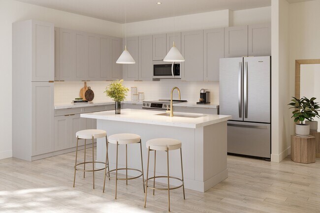Upscale living starts in the kitchen: Premium quartz countertops, stainless steel appliances, and designer lighting create a space that is both stylish and functional - The Residence Peninsula Apartments