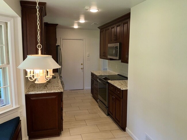 Photo - Very well maintained 4BR 2.5BA 4-level split 2 car attached garage and fully fenced yard