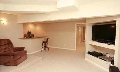 Theater room with wet bar and built-in entertainment center and hidden wiring room; stadium seating - 6782 Swadley Court