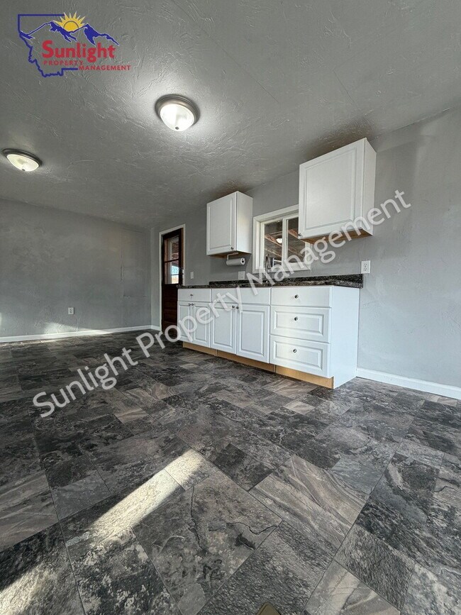 Photo - Spacious 5-Bedroom Home with Open Layout, Off-Street Parking & Large Backyard