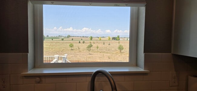 Photo - Discover this spacious 4-bedroom, 2.5-bath home in Mead, CO!