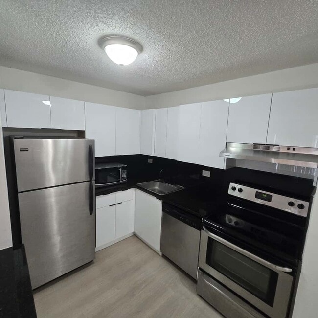 Building Photo - 6935 NW 179th St Unit 204