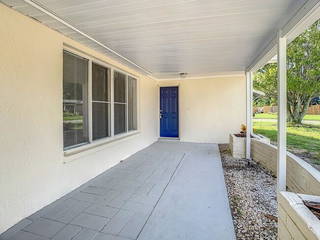 Photo - 2/2/1 with  RENOVATED baths & kitchen, fenced yard, NEW lvp flooring and a OVERSIZED lanai!
