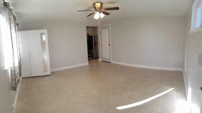 Main living, entryway into kit & laundry - 830 Spruce Ct Unit #A