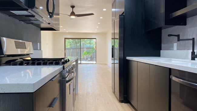 Kitchen facing Living room and outdoor patio - 6474 Cavalleri Rd Unit 6474