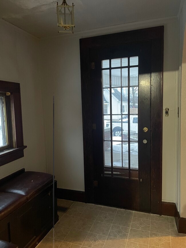 Small seat by other door - 217 S Lawton St