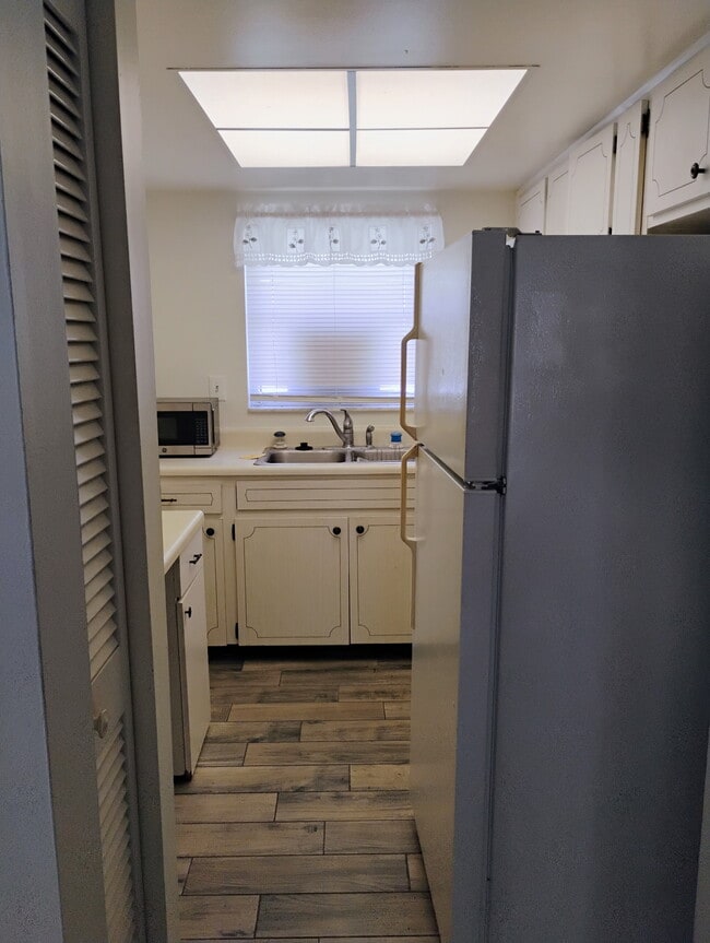 Kitchen off living rm fridge pulled away from wall - 2831 Swifton Dr Unit Swifton Villas 15