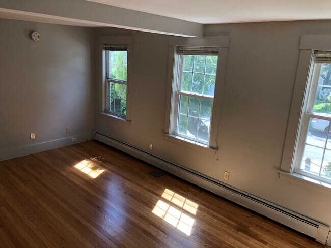 Living room. Lots of natural light. - 33 Pleasant St Apartments Unit 1