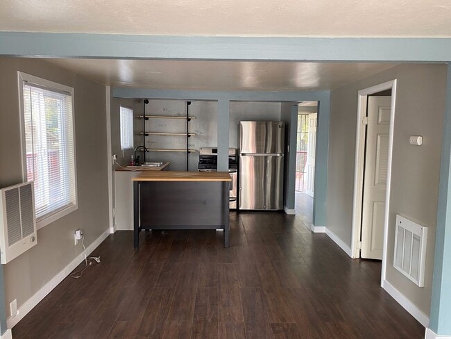 Photo - Little cottage nestled in a street surroun...