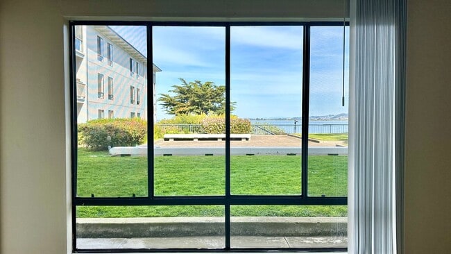 Building Photo - Water Views - Walk to the Water from your ... Unit E209