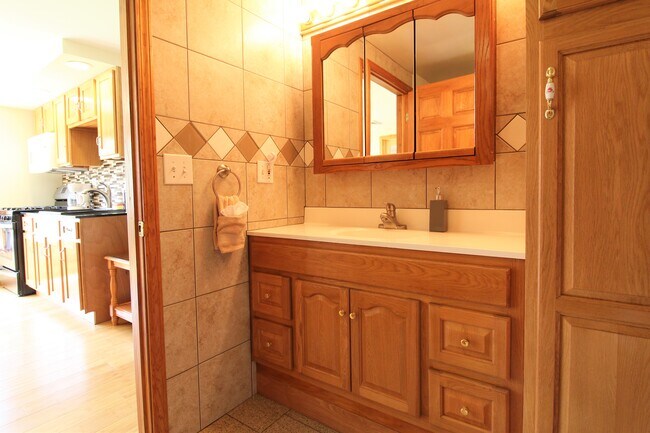 Fully tiled, modern bathroom