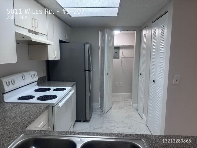 Building Photo - 5011 Wiles Rd Unit #3-207